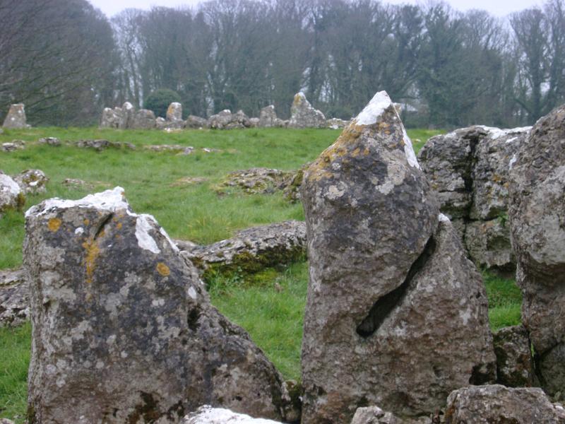 Stone circle or natural granite megaliths in a green field conceptual of pixies , fairies and witchcraft
