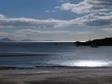 Silhouette View Towards the Welsh Mainland from Romantic Beach of Llanddwyn Island During Afternoon.