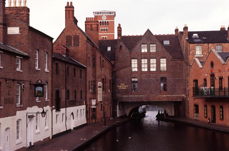 Historical Birmingham Canal with it red brick industrial warehouses and wharfs where the long boats used to dock