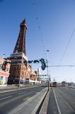 tram lines and an approaching tram just outside blackpool tower