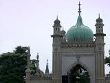 Exterior view of the ornate architecture of the Pavilion Gate House at the Royal Pavilion, Brighton, with its arched entrance, onion dome and minarets