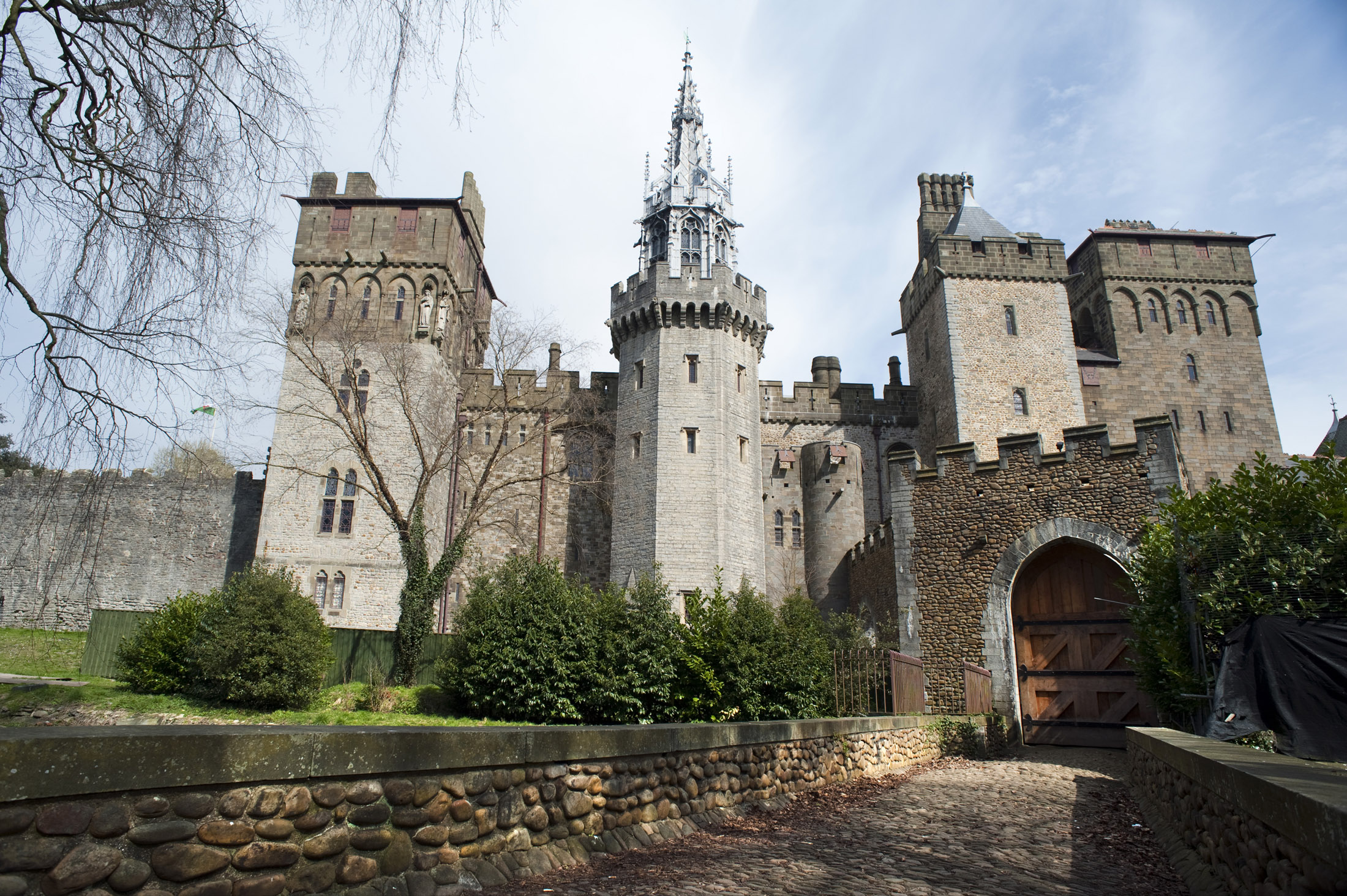 an image of decorative gate and apartments at cardif castle built in the gothic revival style in the 19th century