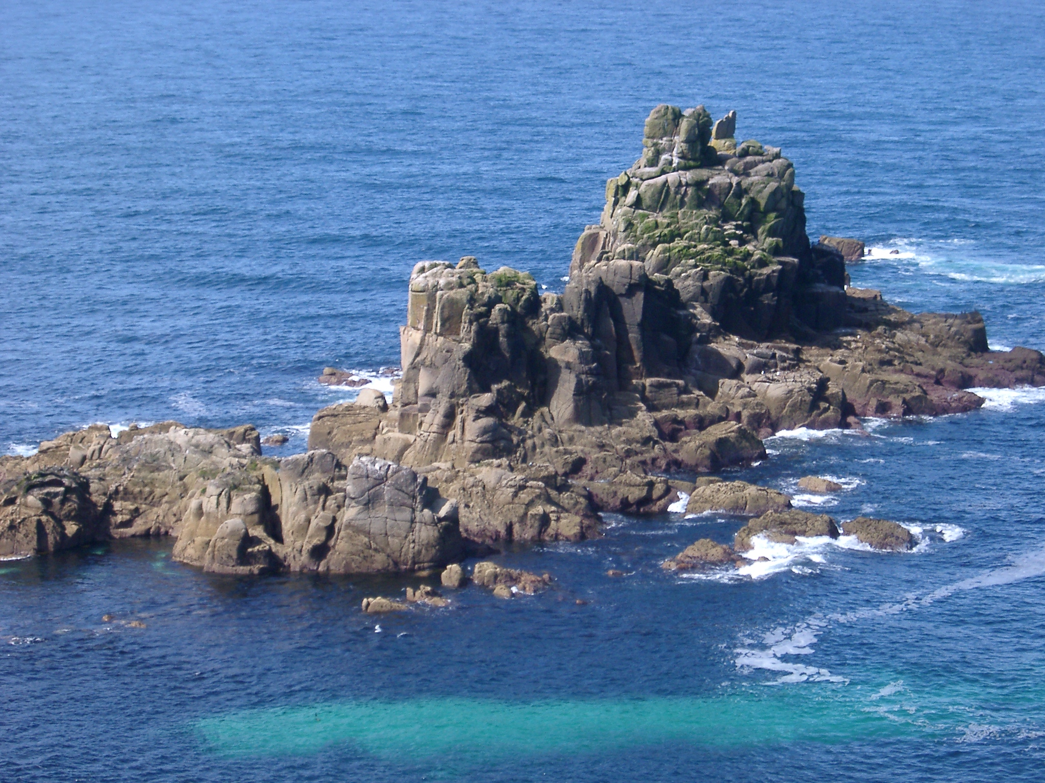 an image of rocks off the coast at lands end, cornwall,