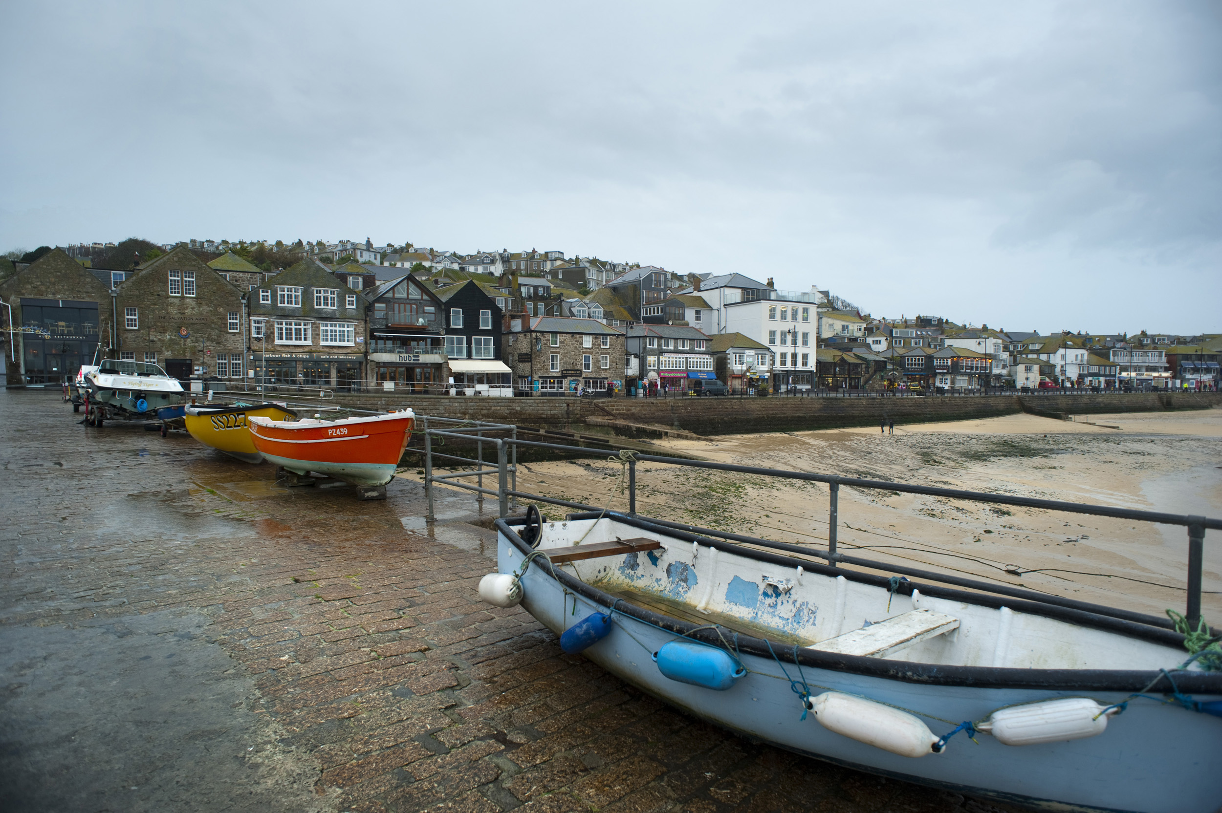 an image of Small fishing boats and tenders on the quayside at St Ives, Cornwall