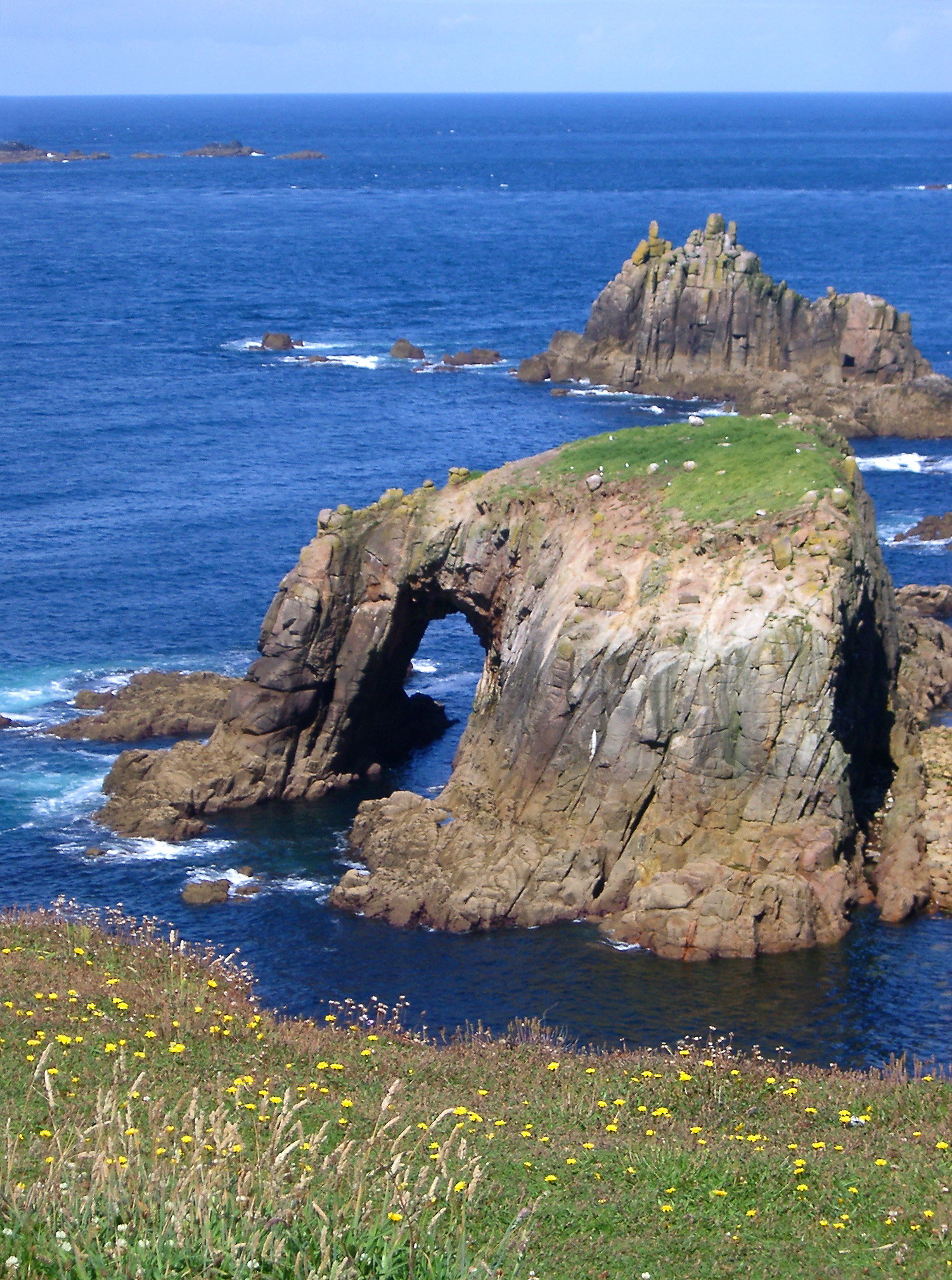 an image of Enys Dodnan arock arch at landsend cornwall