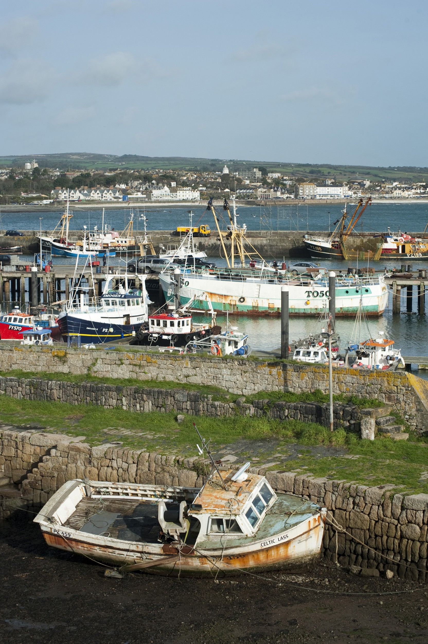an image of fishing boats in the harbour at newlyn cornwall