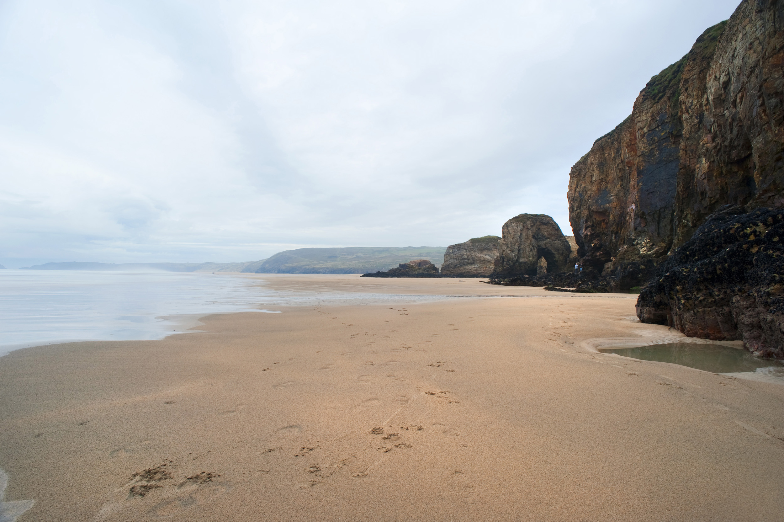 an image of sandy beach at parrenporth, cornwall