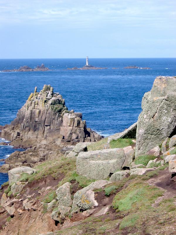 coastal outcrops and the longships lighthouse at lands end cornwall