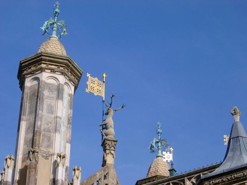 gothic revival roof decorations pictured against a blue sky