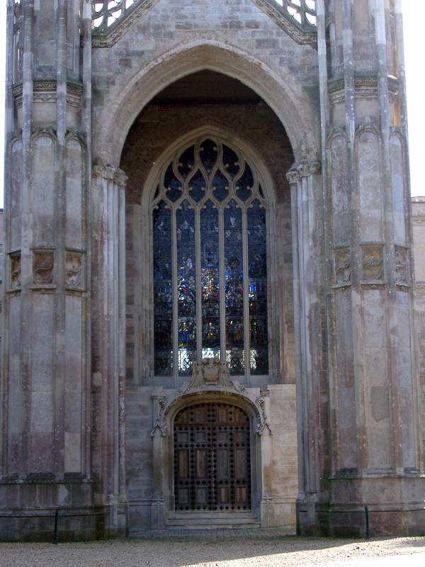 gothic revival door and stained glass window