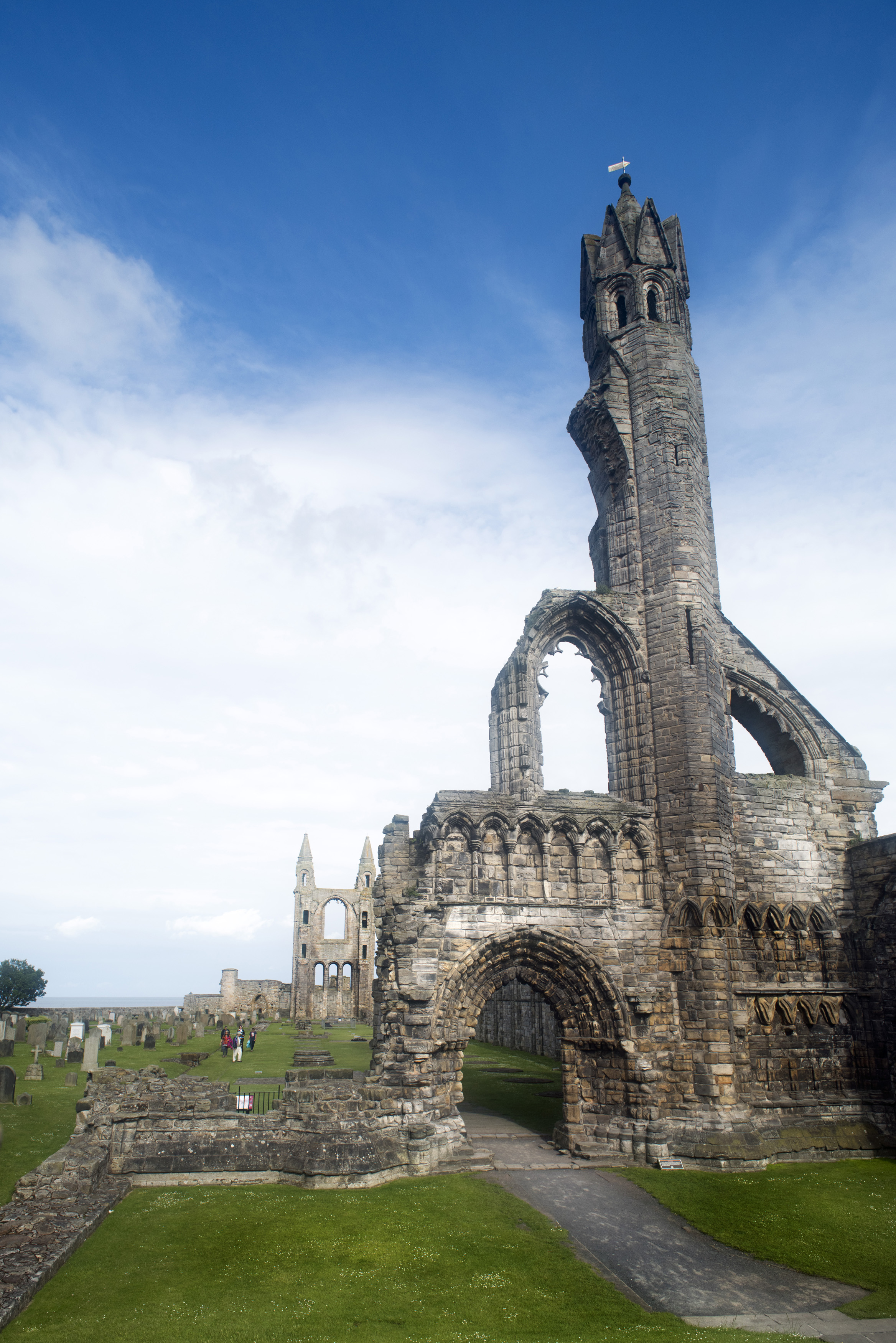 an image of Beautiful Scottish ruins of St. Andrews cathedral as feathery clouds stretch overhead