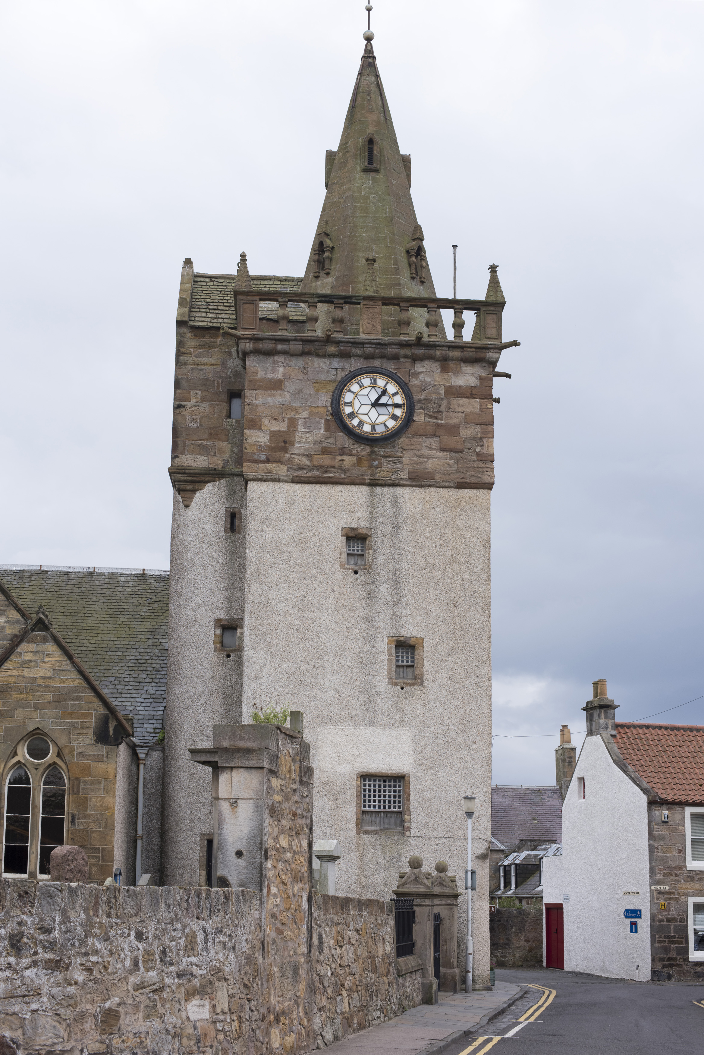 an image of Historical clock tower and church in Pittenweem, Scotland, a fishing village on the Fife Coast
