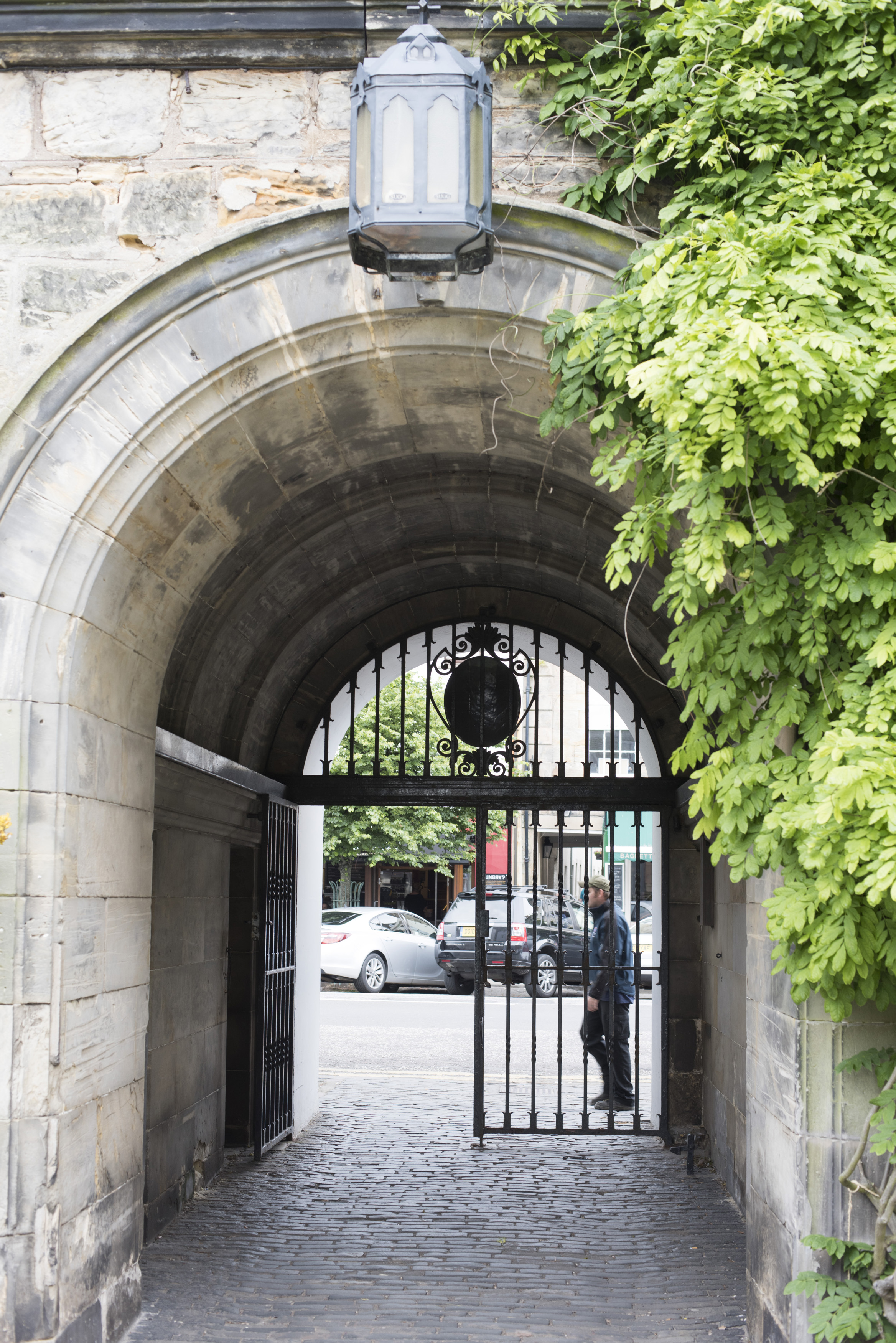 an image of Iron gate and stone archway at the historic European landmark University of Saint Andrews in Scotland