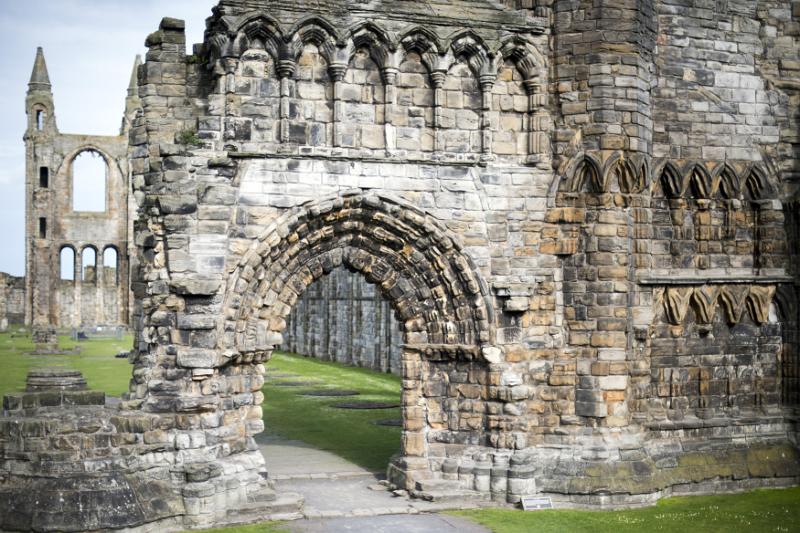 View on front facade of Saint Andrews cathedral with early English type gothic arch and weathered bricks