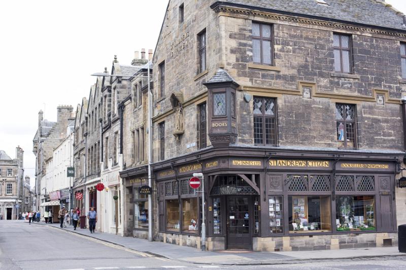 Historic weathered stone brick and wooden downtown buildings at Saint Andrews, Scotland