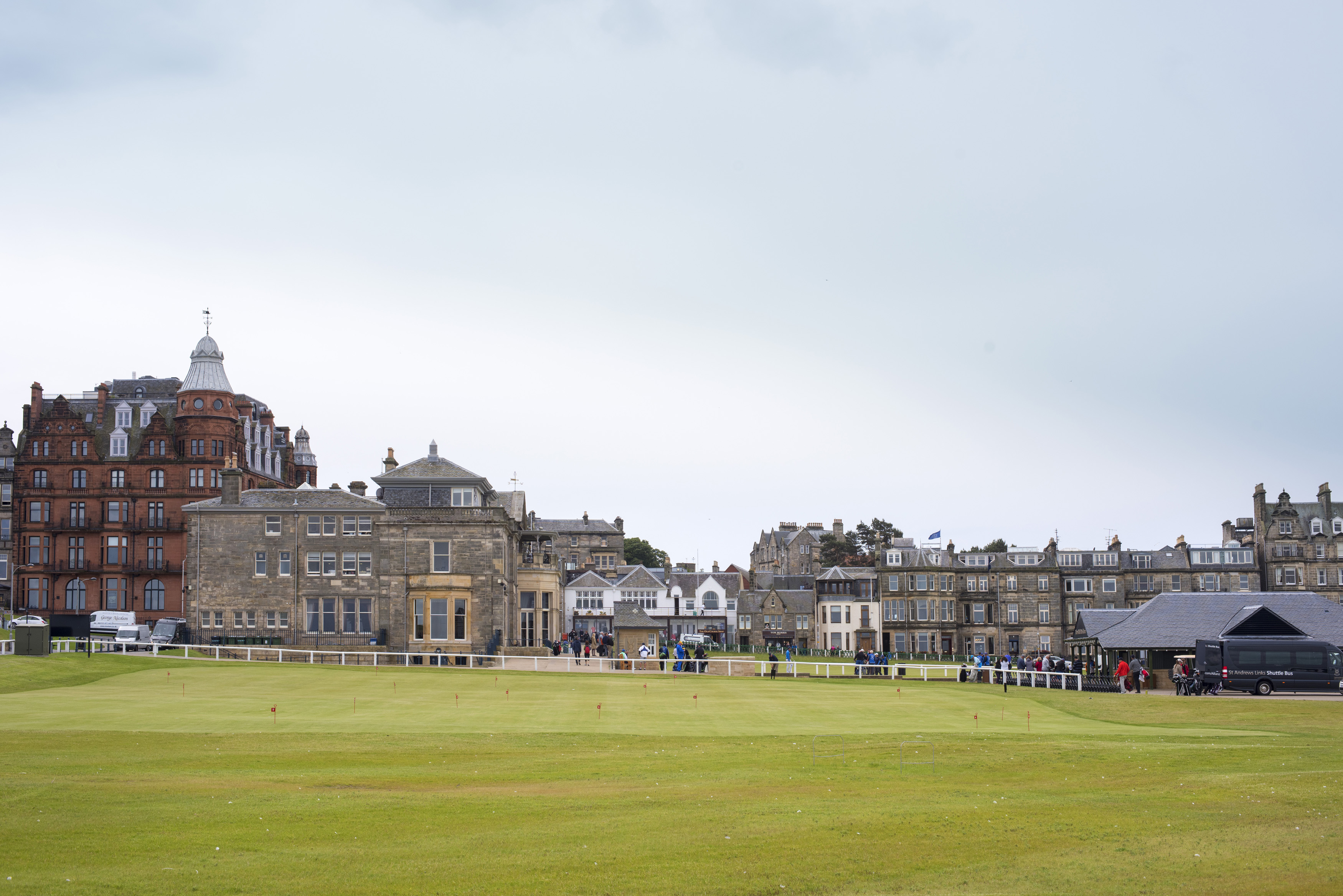 an image of View across an open field of St Andrews, Scotland with its historic architecture in a scenic landscape for a travel and tourism concept
