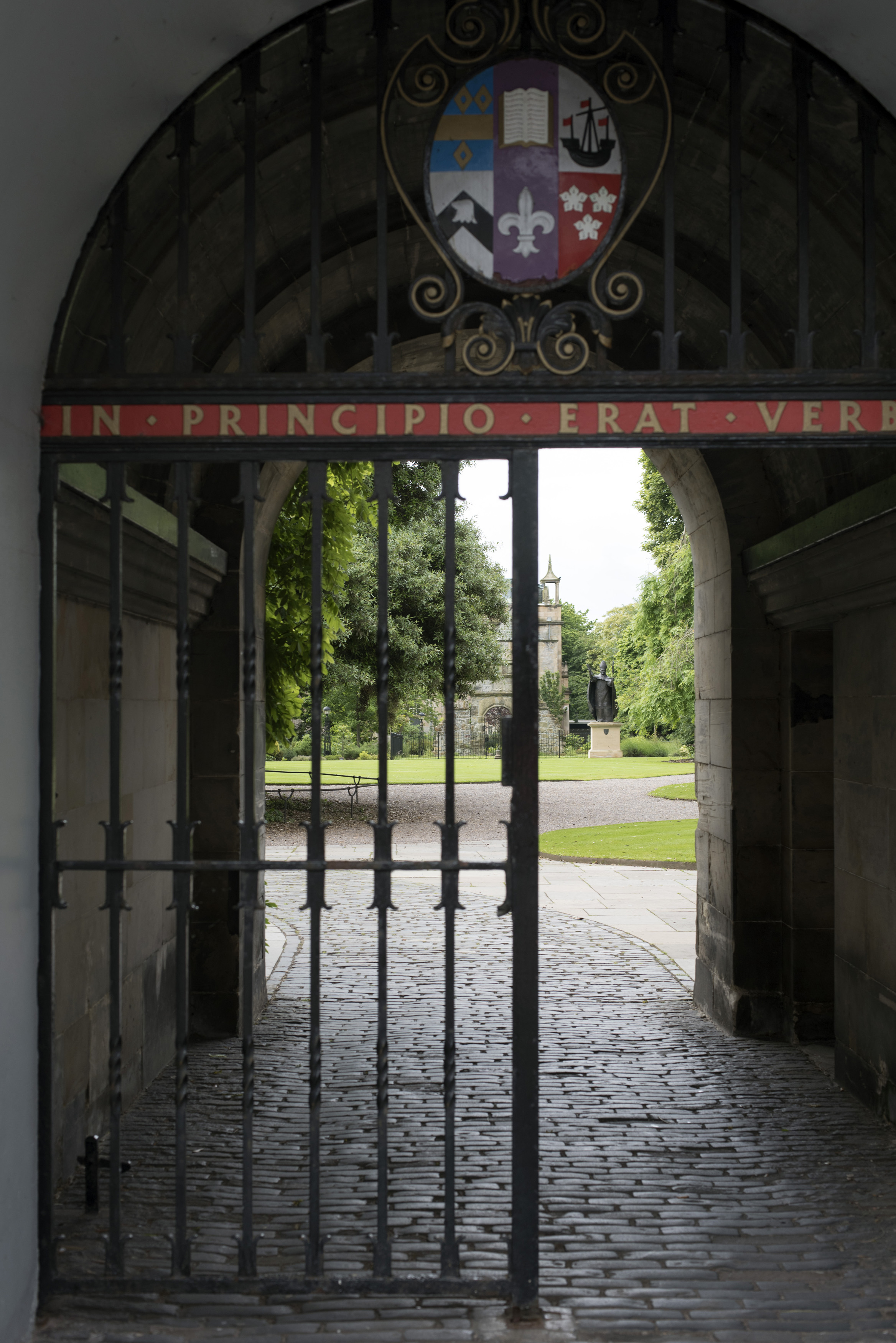 an image of View of the grounds through a wrought iron entrance gate to St Andrews University, Scotland