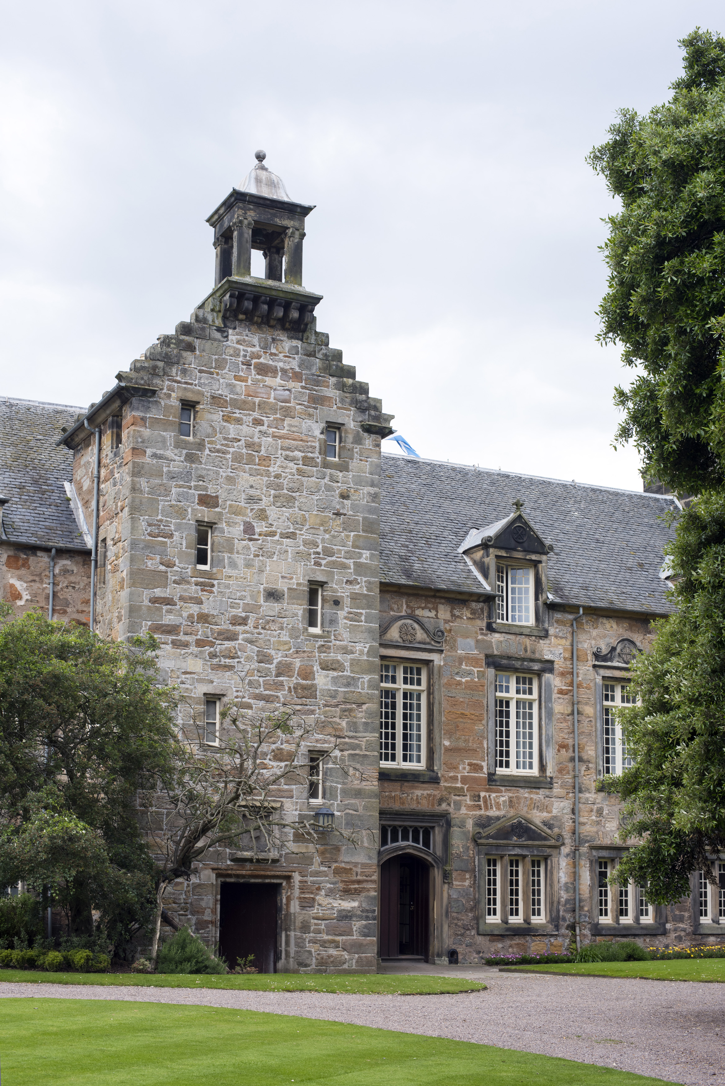 an image of University of Saint Andrews with small windows and a bell tower above the entryway