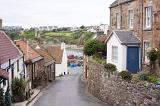 Narrow lane down to the waterfront, Crail, Fife Coast, Scotland, lined with quaint cottages in a scenic landscape view