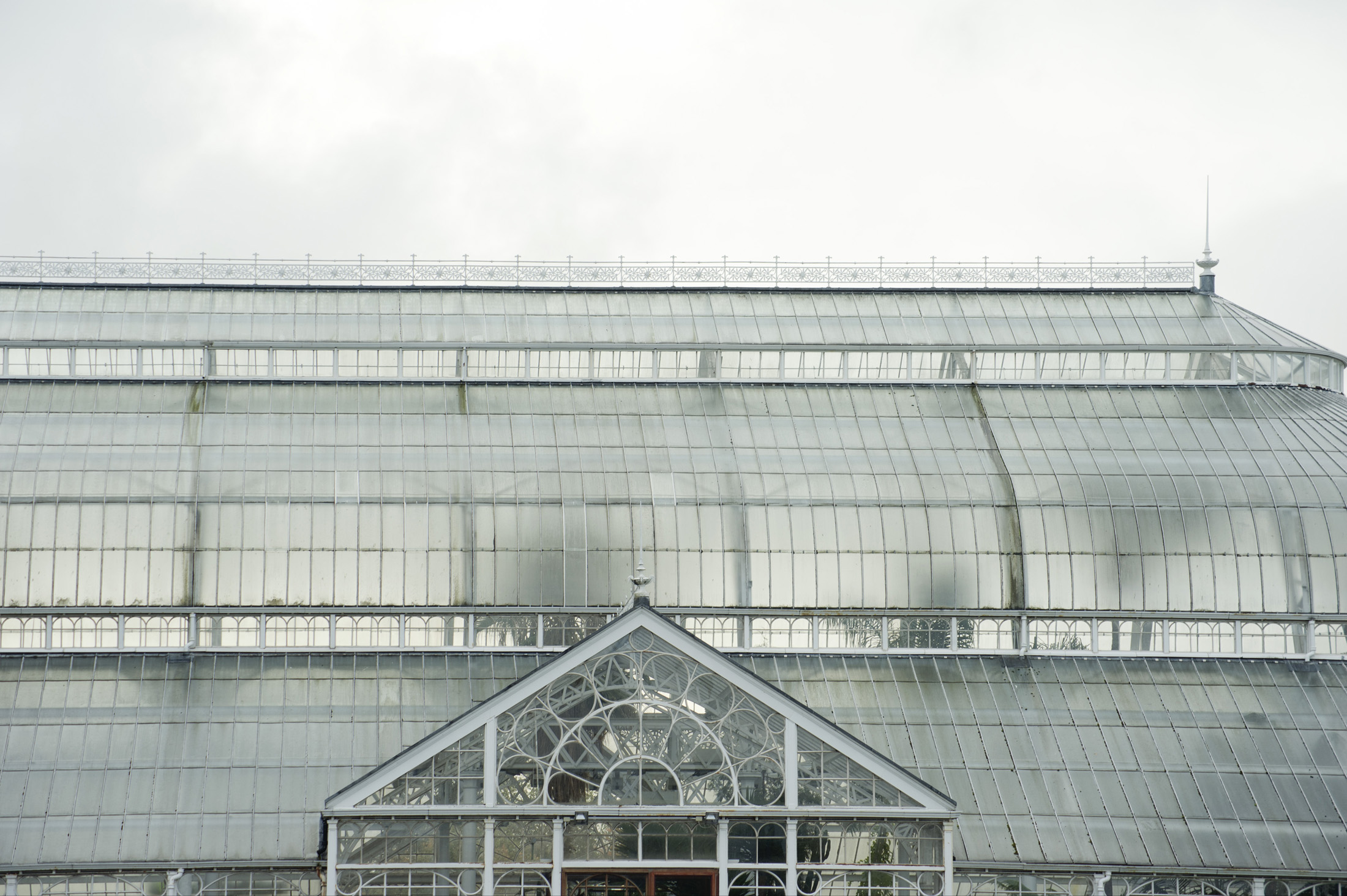 an image of View of the domed roof and exterior facade of the People Palace Winter Gardens in Glasgow, Scotland, a huge Victorian glasshouse which now houses a museum and exhibitions