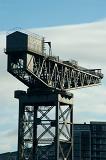 historic clydeport crane on the side of the river clyde, glasgow
