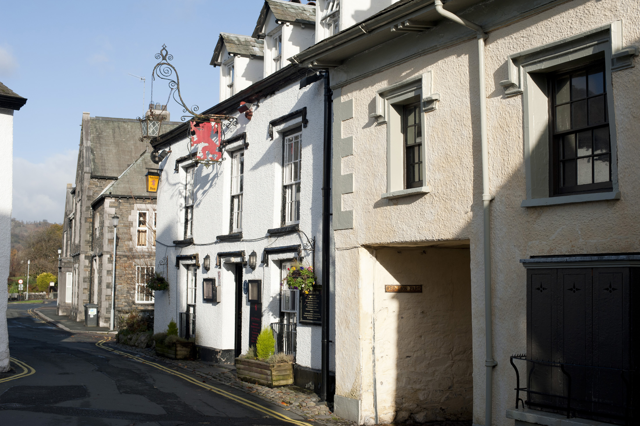 an image of View from the street of the external facade of the Red Lion Inn in the village of Hawkshead in the Lake District in Cumbria