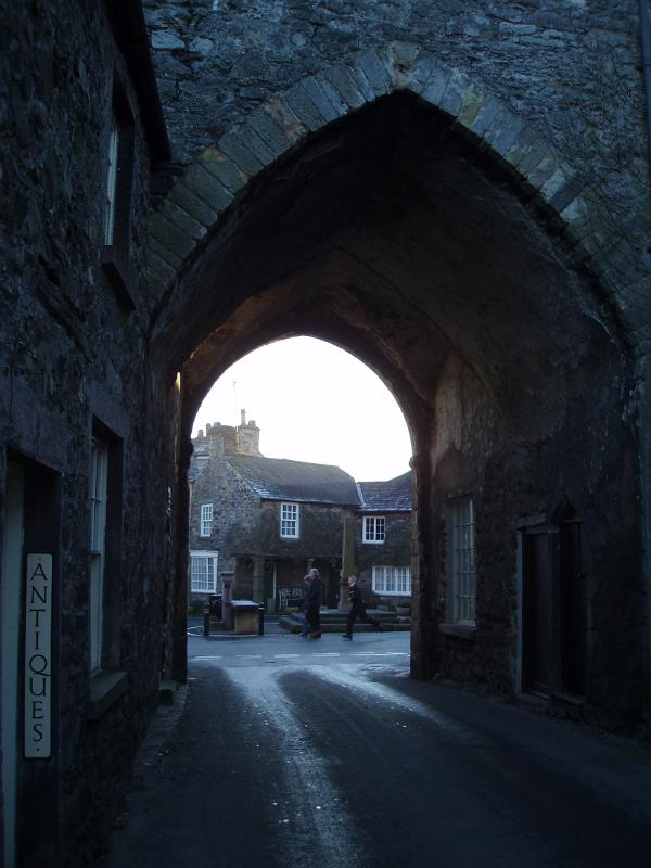 stone arch gatehouse in cartmel village