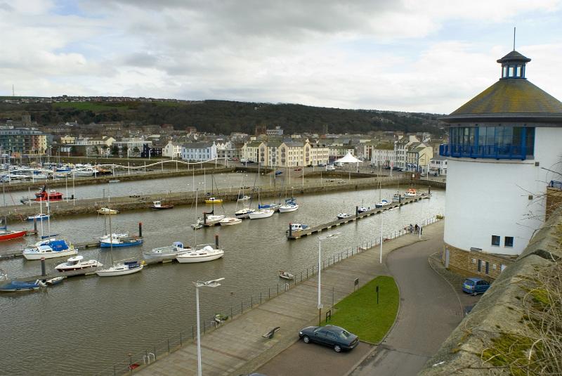 boats in the harbour in whitehaven cumbria viewed from near the beacon museum