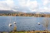 Yachts in Windermere Lake in the Lake District with a view across towards Loughrigfell and the Langdales