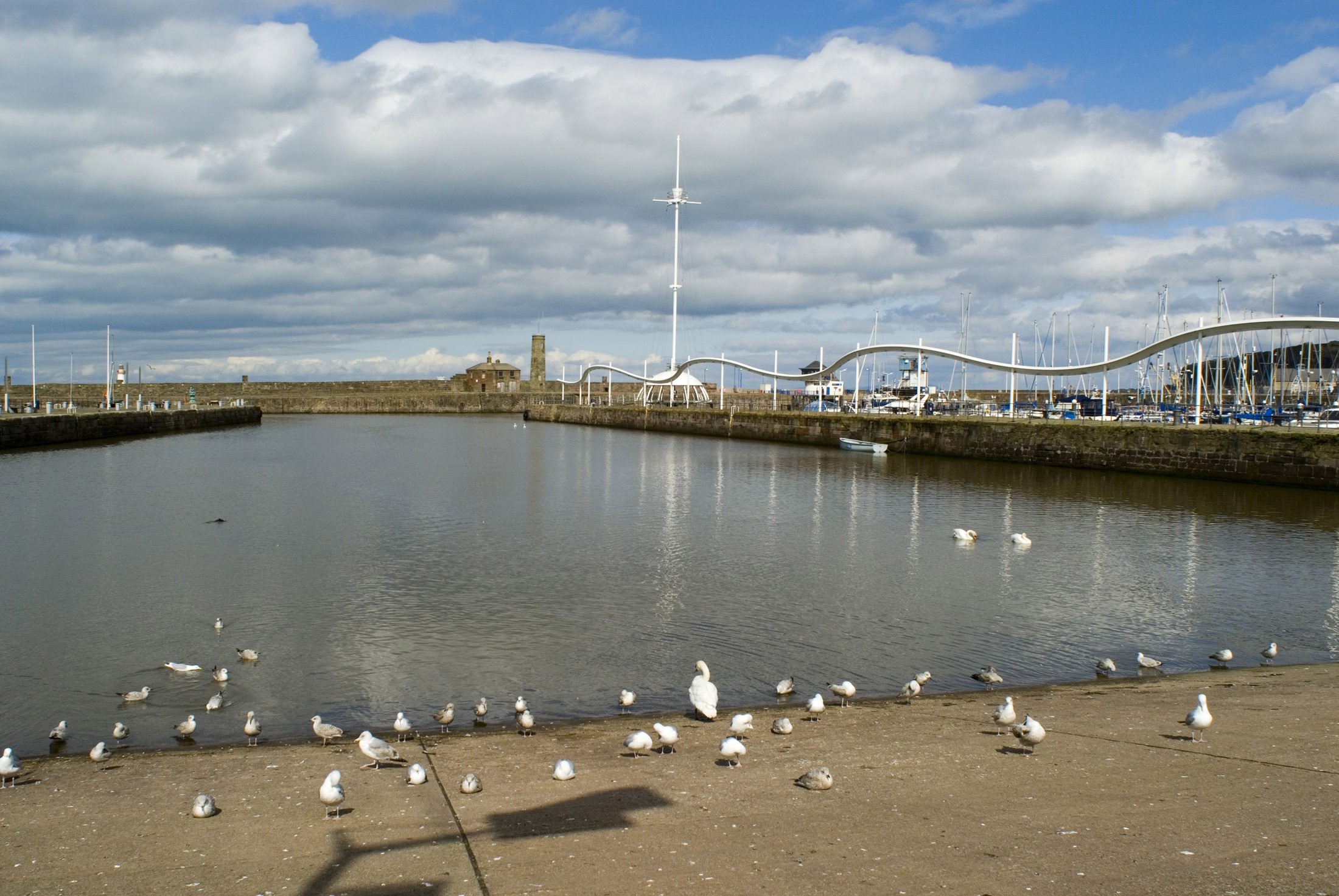 an image of the renovated whitehaven harbour and wave light sculpture and crows nest