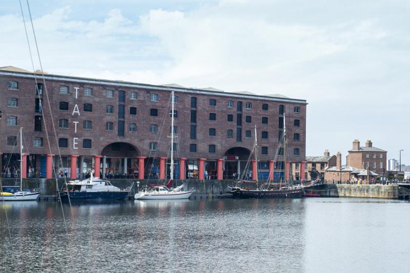 Boats parked near famous landmark tourist destination known as Liverpool Albert Dock in the United Kingdom