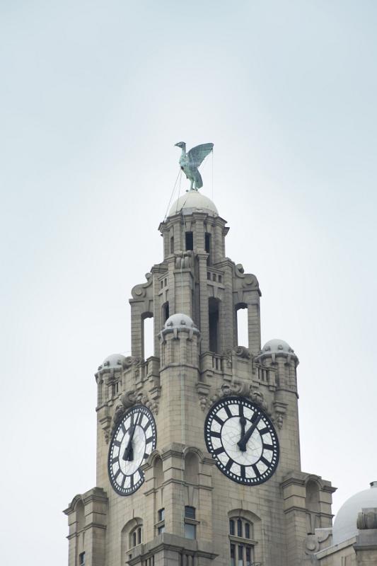 Clock tower on the Liver building, Liverpool, England surmounted by one of the two Liver Birds, a cormorant, wich if it were to fly away would mean the end of the city