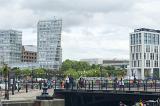 Groups of tourists walking over a footbridge at the Liverpool Albert Dock in the United Kingdom