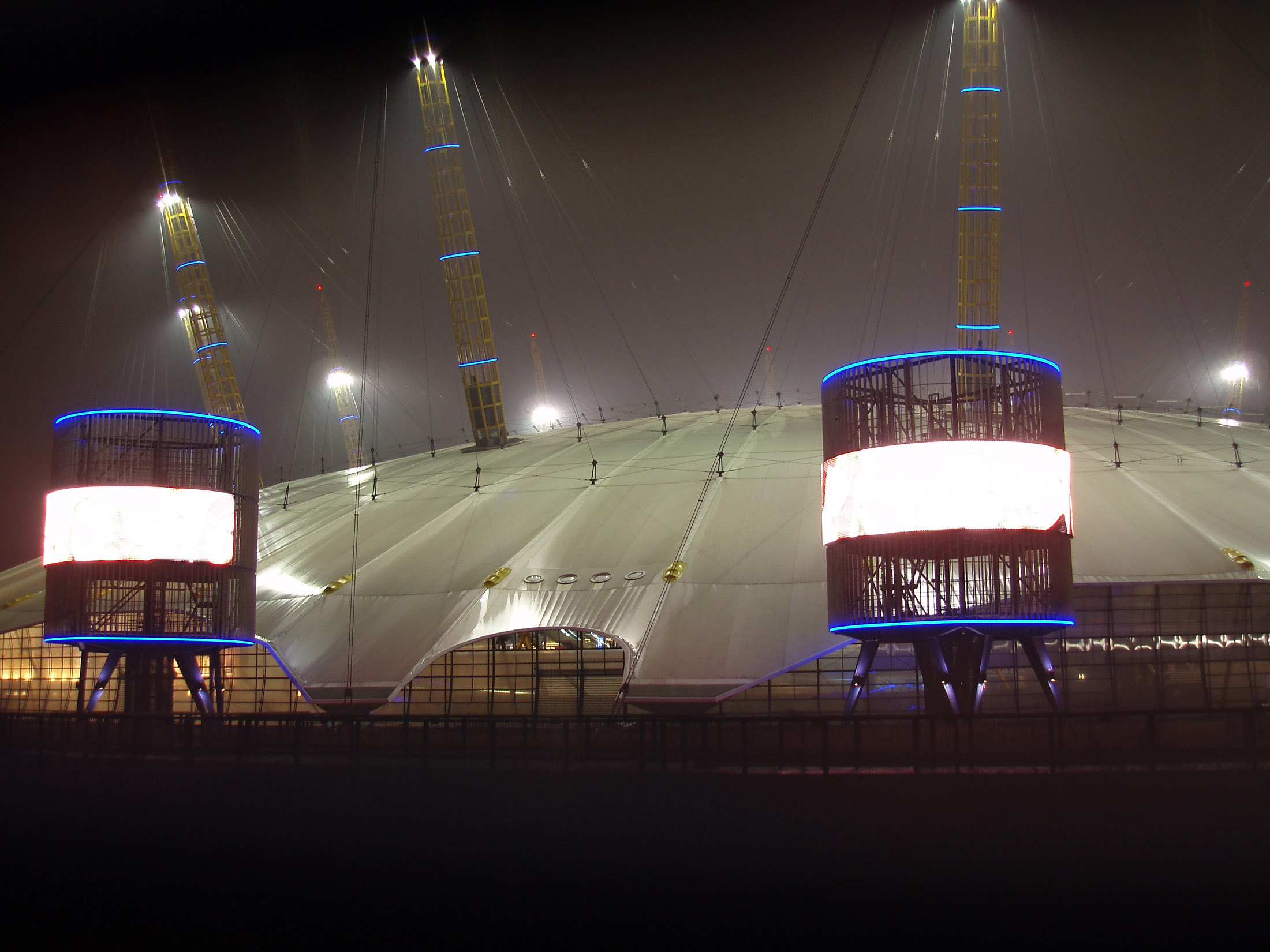 an image of The Millennium Dome or The O2 on the Greenwich peninsula, London is a modern arena and the largest dome originally built to house exhibitions to commemorate the Millennium seen illuminated at night