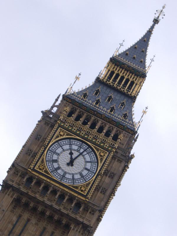 Big Ben - low angle view of the famous Clock Tower in City of Westminster, England. Captured with Very Light Blue Sky Background.