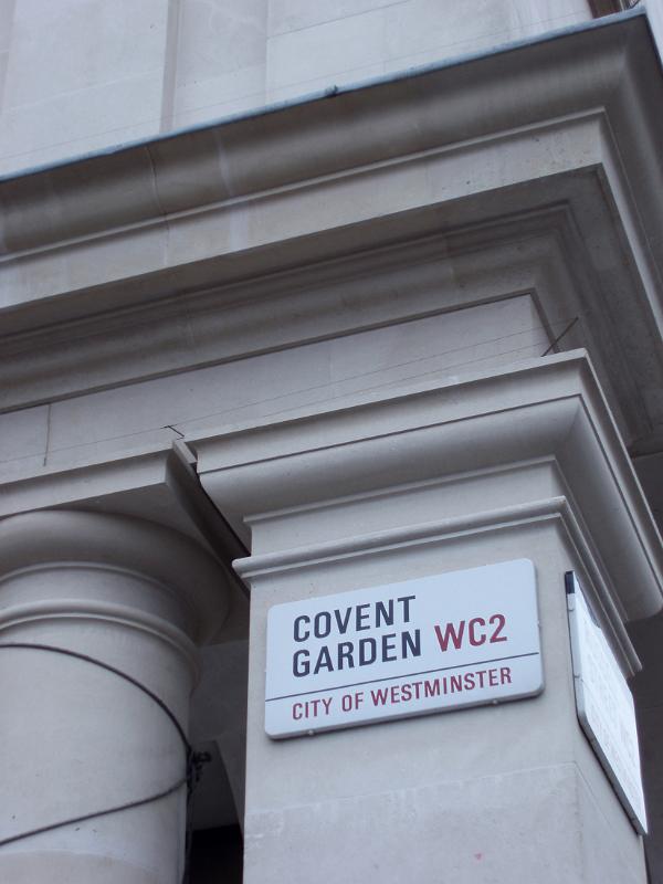 Covent Garden street sign, central London mounted on a stone pillar on a building exterior