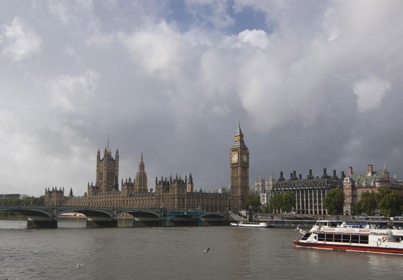 a view of the palace of westminster and big ben clock tower from across the river and westminster bridge