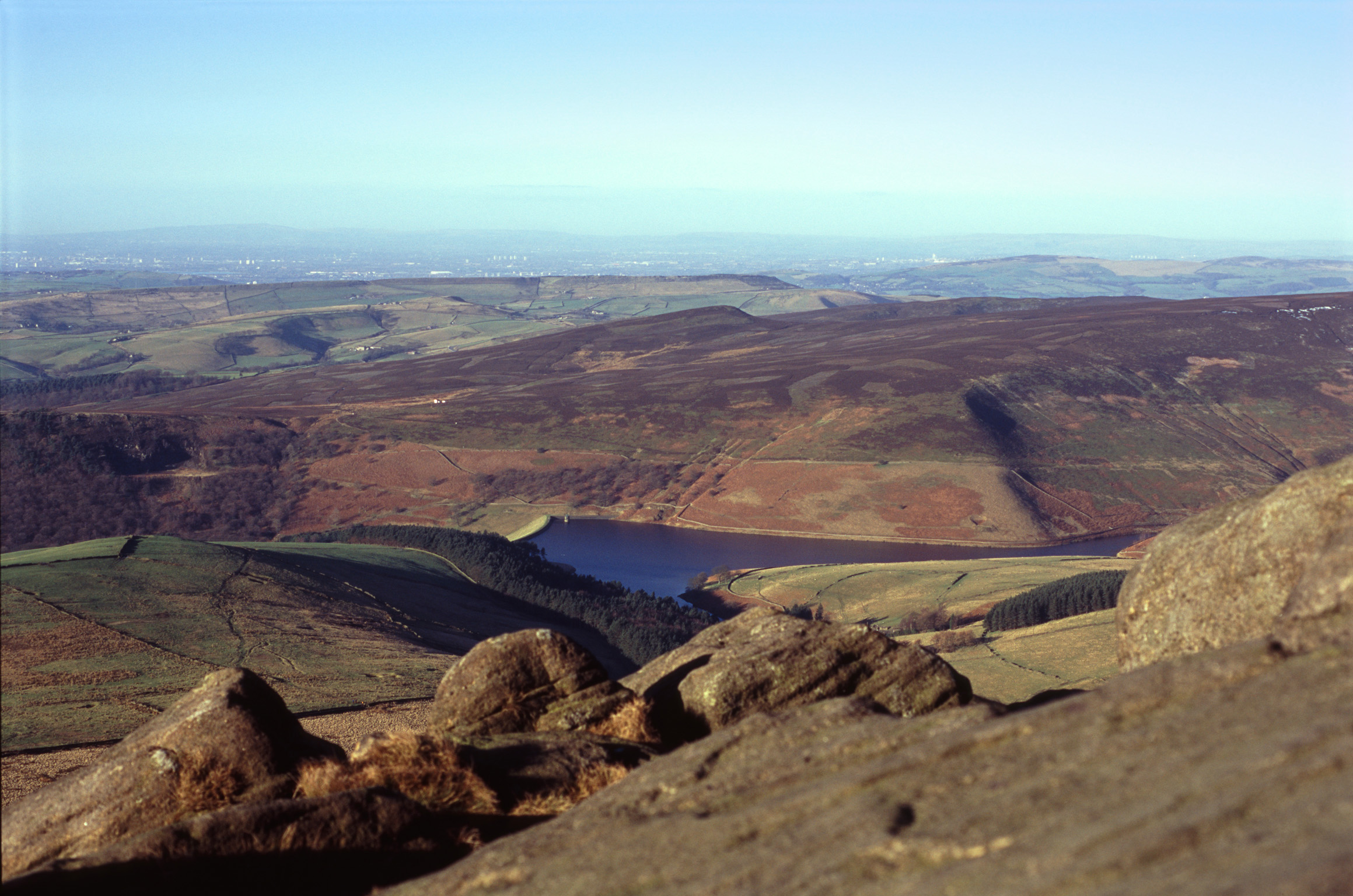 an image of View from Kinder Scout of a water resevoir in the hills of the Derbyshire Peak District, UK