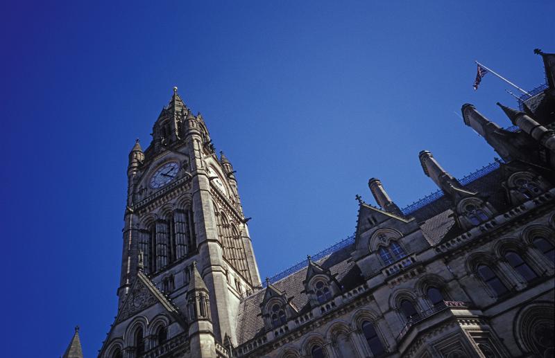 low angle view looking up at the clock tower of manchester town hall