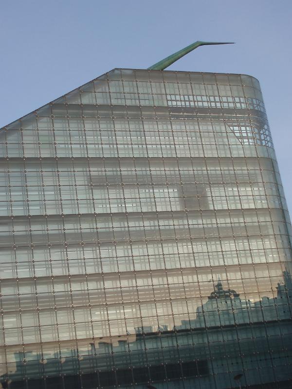Modern glass exterior of the Urbis building, a futuristic museum and exhibition center in Manchester, Lancashire, UK