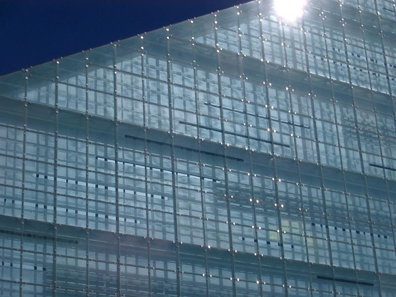 sun glinting off the side of the urbis building in central manchester