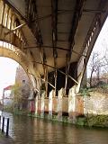 Old iron railway bridge crossing an industrial canal in Castlefield, Manchester, an innercity conservancy area to the Industrial Revolution