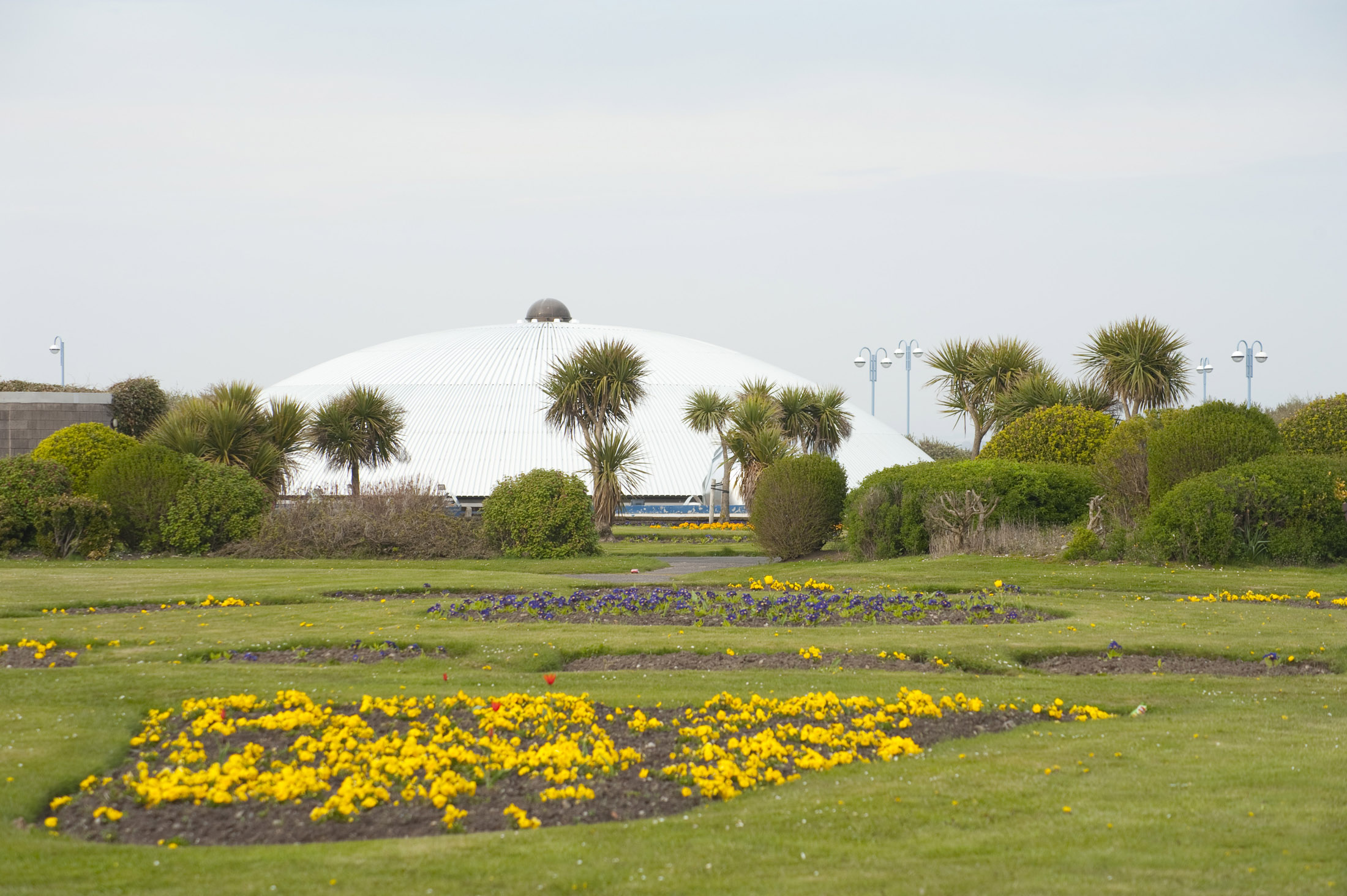 an image of another view of the (no longer super) dome across some of morecambes once beautiful flower beds