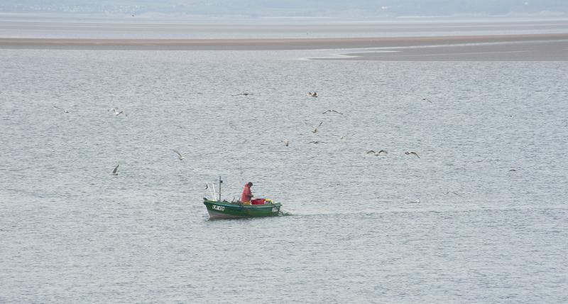 fishing from a small boat on morecambe bay