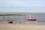 fishing boats on morecambe sands at low tide