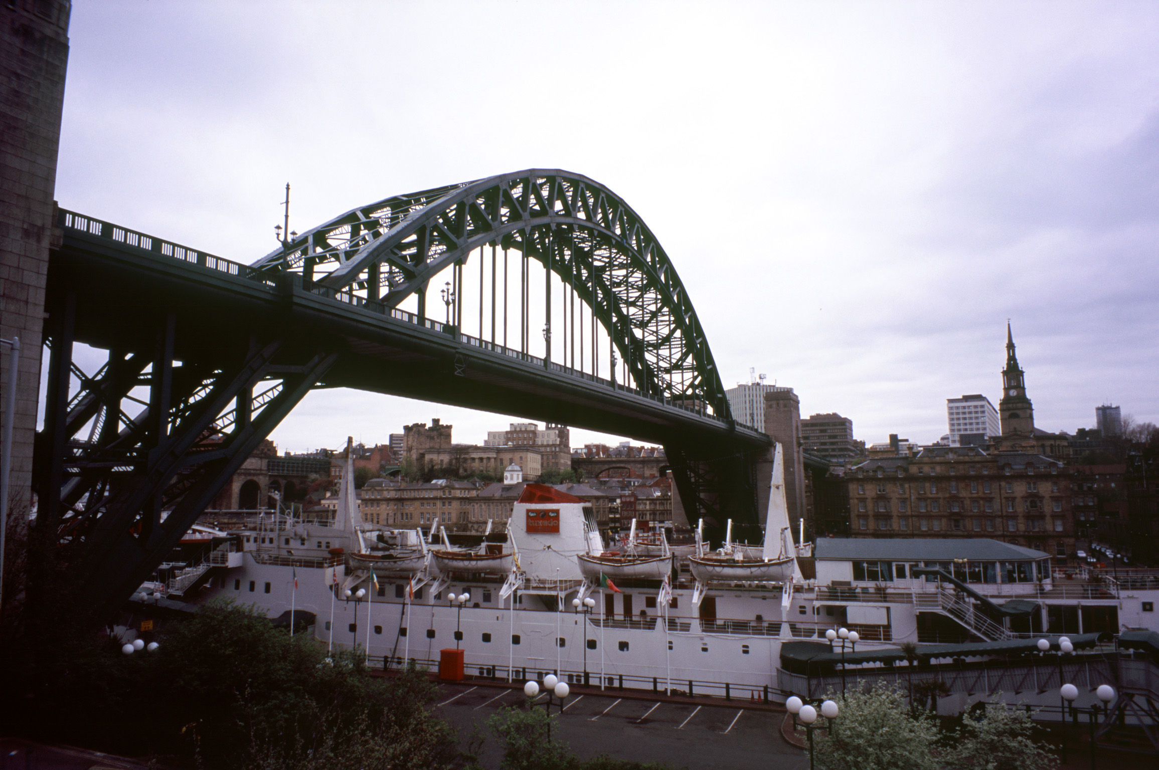 an image of Tyne Bridge, Newcastle is an iconic through arch steel bridge with a single span crossing the River Tyne connecting Newcastle and Gateshead