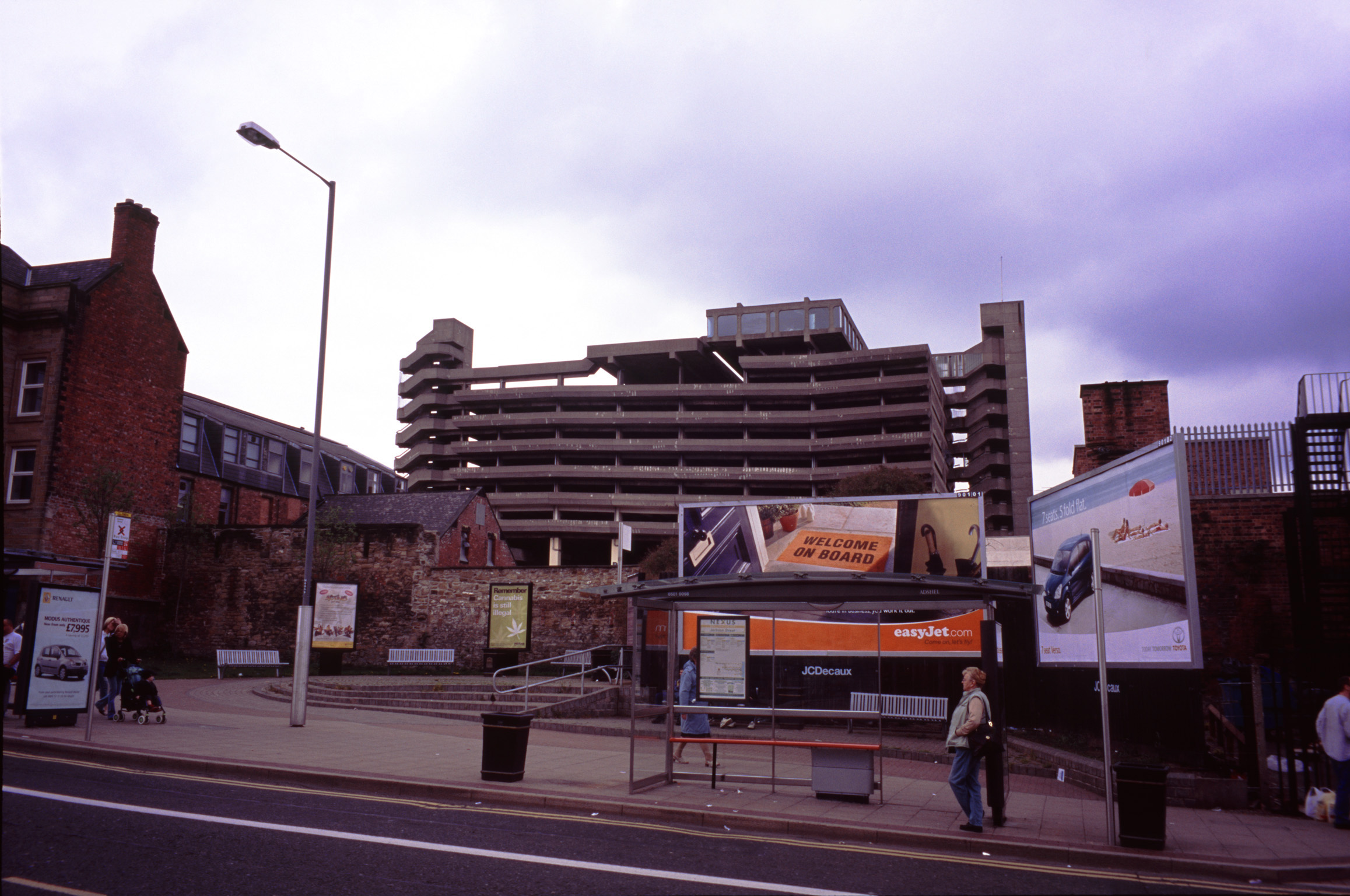 an image of Exterior View of Architectural Building of Trinity Shopping Centre Along the Street in England.