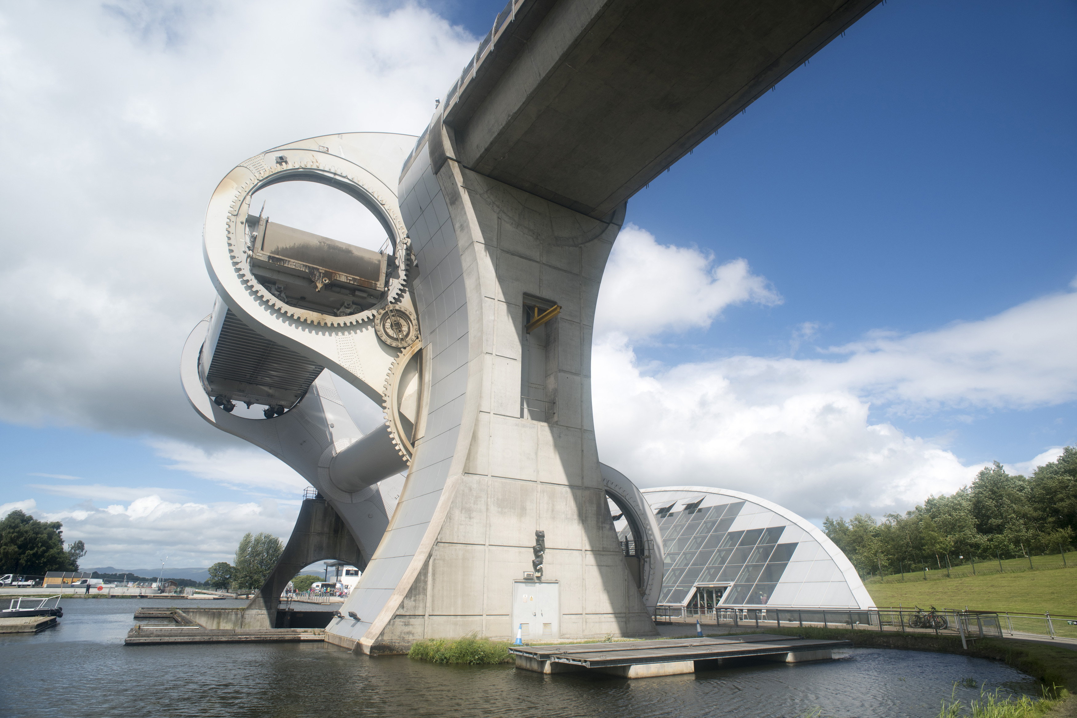 an image of Low angle view of rotating boat lift in Scotland connecting two canals on a sunny day