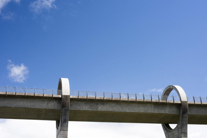 Viaduct for Falkirk Wheel Boat lift structure under blue sky with scattered white clouds in Scotland