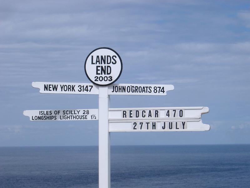 Signpost at Lands End, the most westerly point on mainland UK and a popular tourist attraction